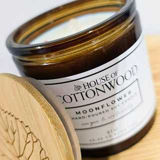 Candle jar with 'House of Cottonwood' label with bamboo lid